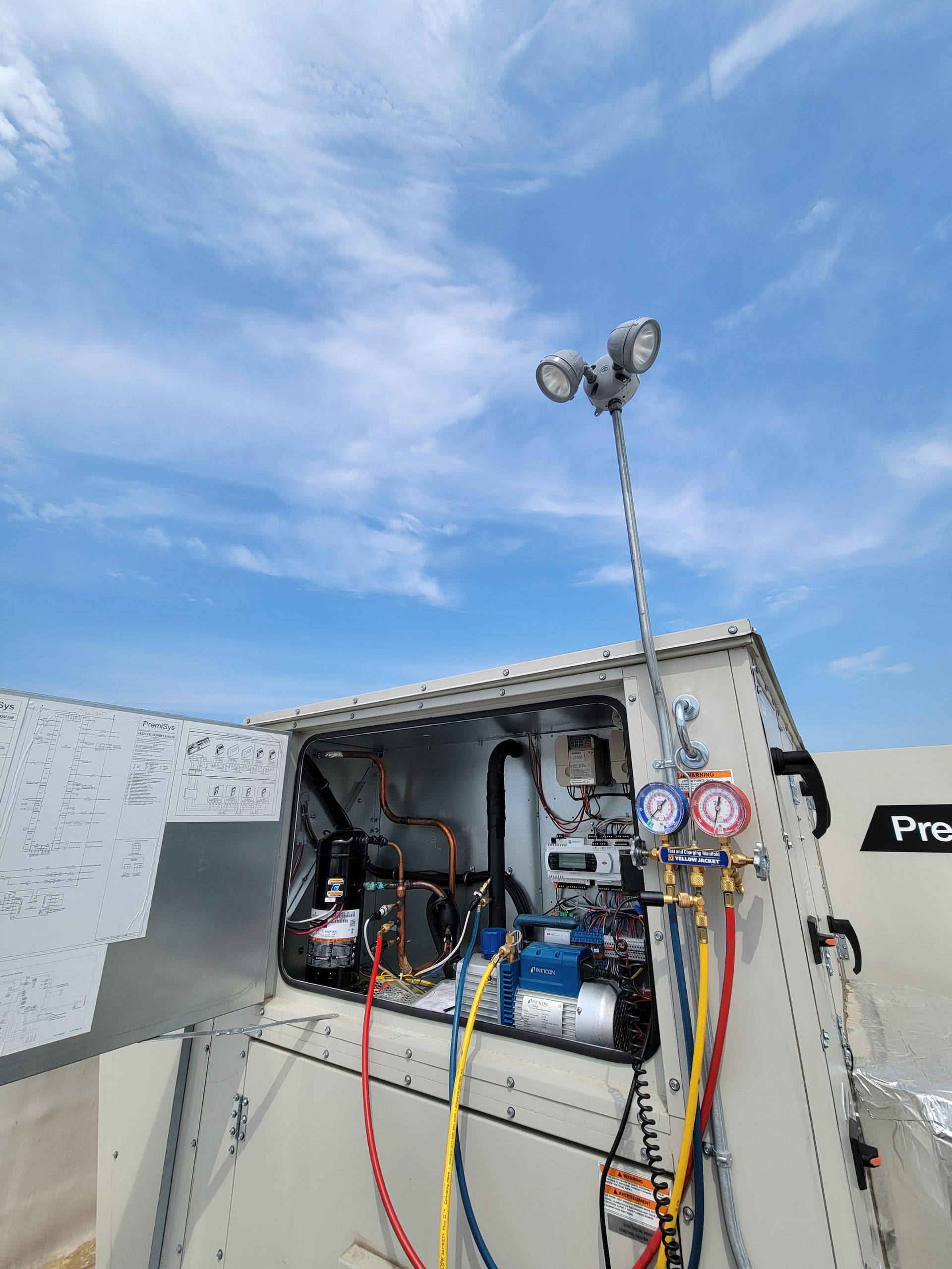The inside of a machine with a blue sky in the background