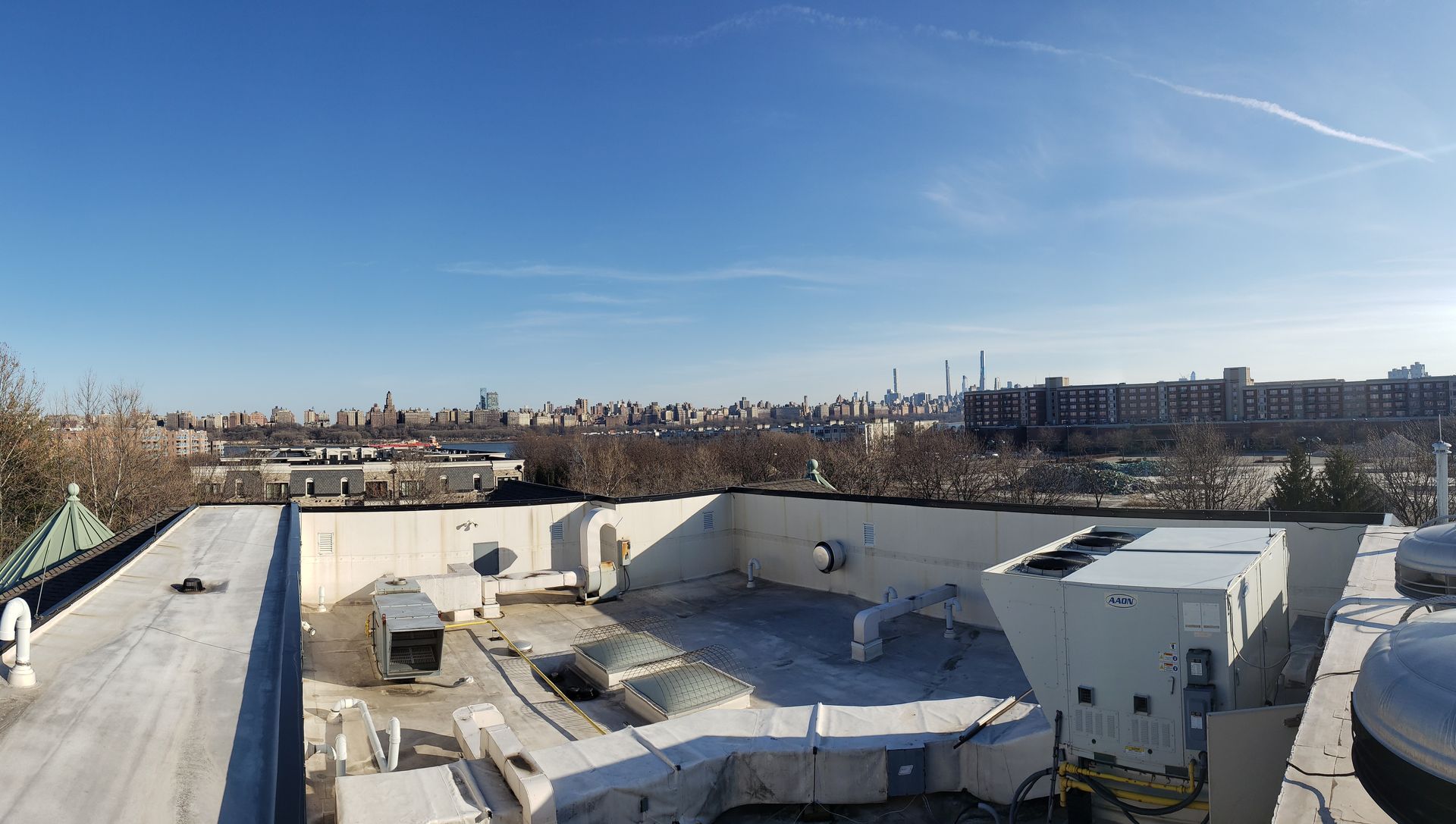 A view of a city from the roof of a building.