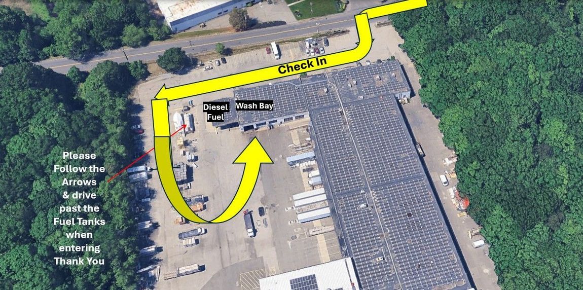 Satellite view of a parking lot with a yellow route arrow guiding a path through trees and parked cars