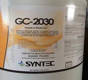 Label on a white Synertec GC-2030 cleaner and disinfectant bottle with hazard warnings and instructions