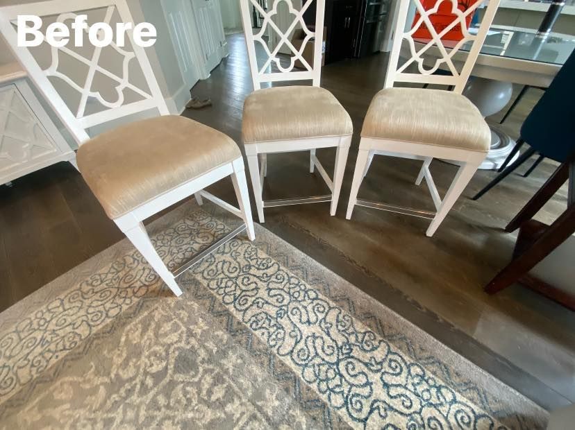 Three white chairs with tan seats on a patterned rug, labeled 