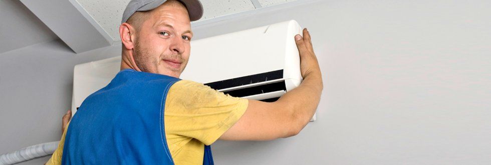 Man installing air condition