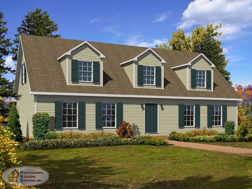 A house with a brown roof and green shutters