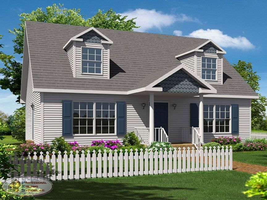 A white house with a white picket fence in front of it