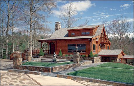 A large wooden house with a stone walkway leading to it