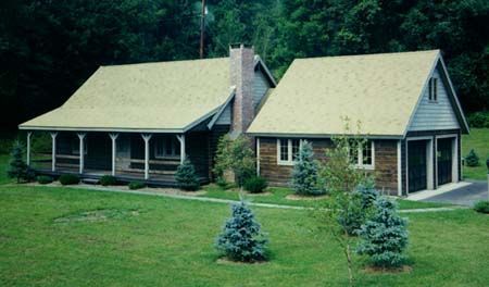 A house with a porch and a garage next to it