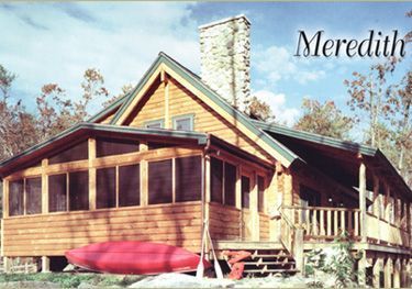 A picture of a house in meredith with a red kayak on the porch