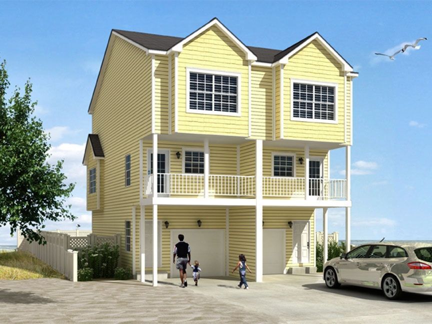 A yellow house with a car parked in front of it