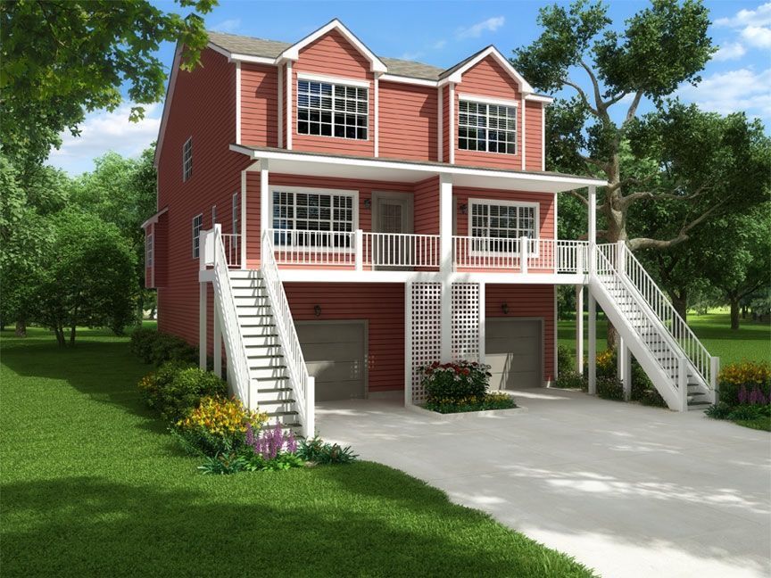 A red house with stairs leading up to the second floor