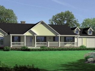 A large house with a black roof and a large porch