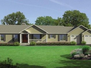 A large house with a large lawn in front of it