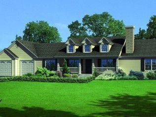 A large house with a large lawn in front of it