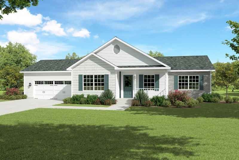 A white house with a black roof and green shutters is sitting on top of a lush green lawn.