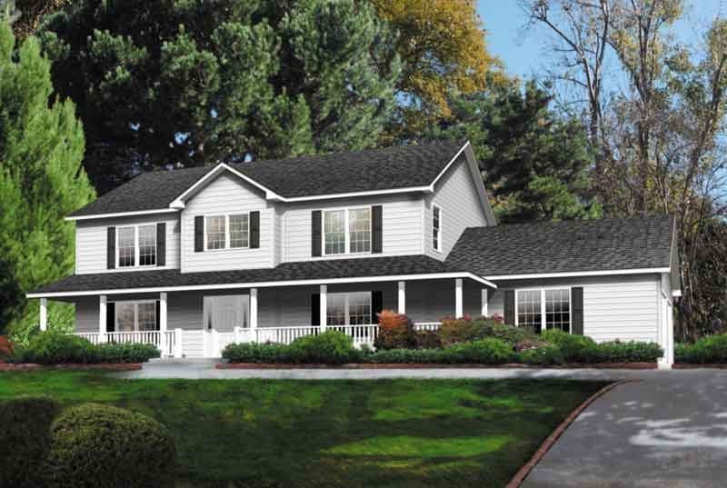 A large white house with a black roof and a large porch