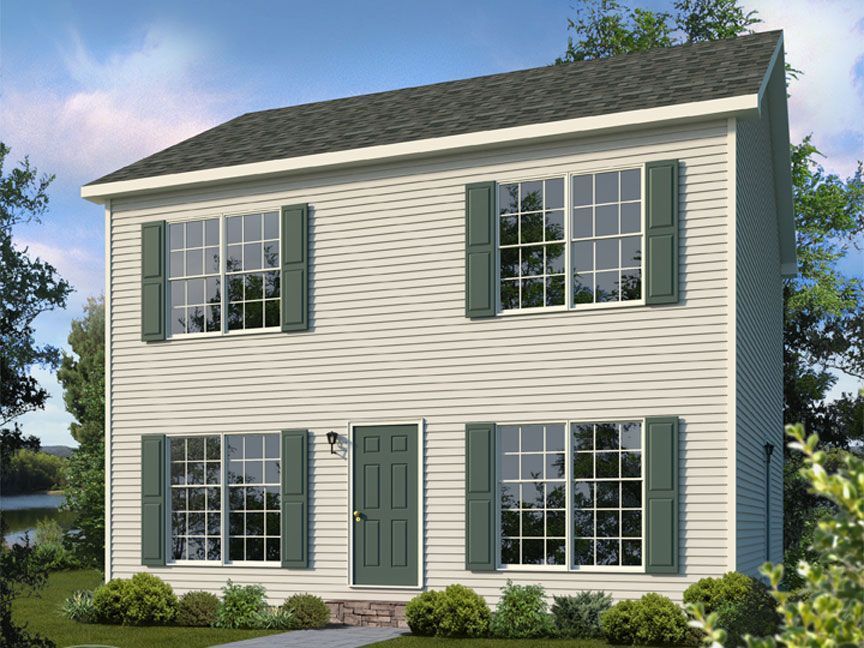 A white house with green shutters and a black roof