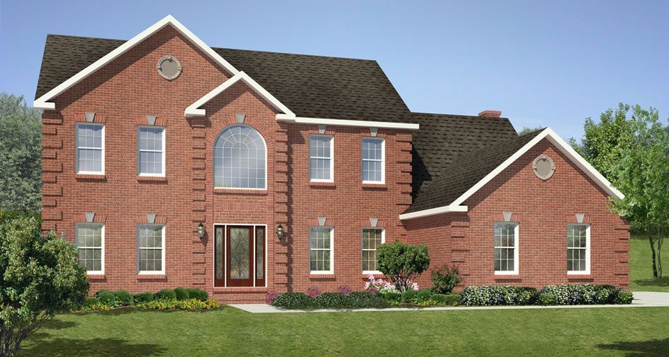 A large red brick house with a black roof