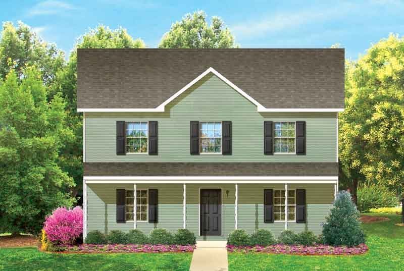 A green house with a brown roof and black shutters