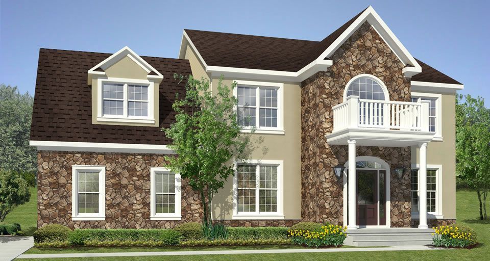 A large house with a brown roof and white trim