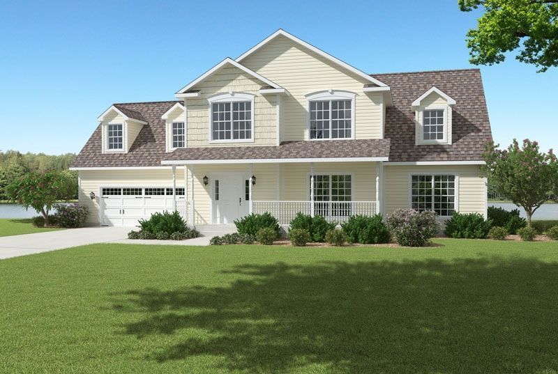 A large white house with a brown roof and a lot of windows