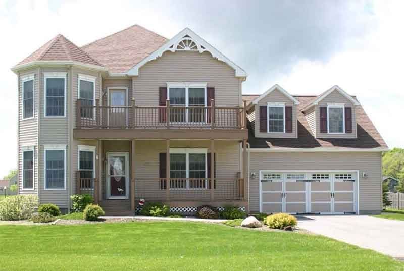 A large house with a large lawn in front of it