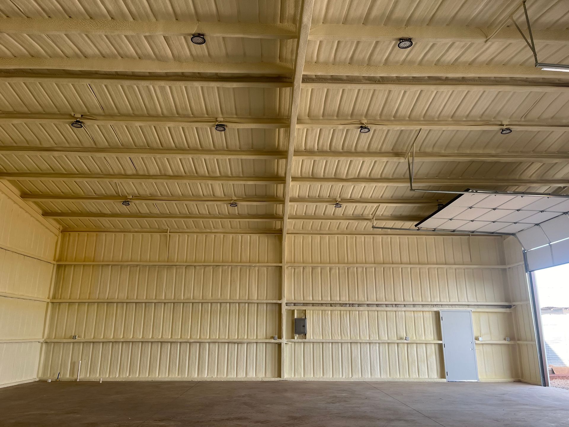 A large empty warehouse with a ceiling and walls covered in foam.