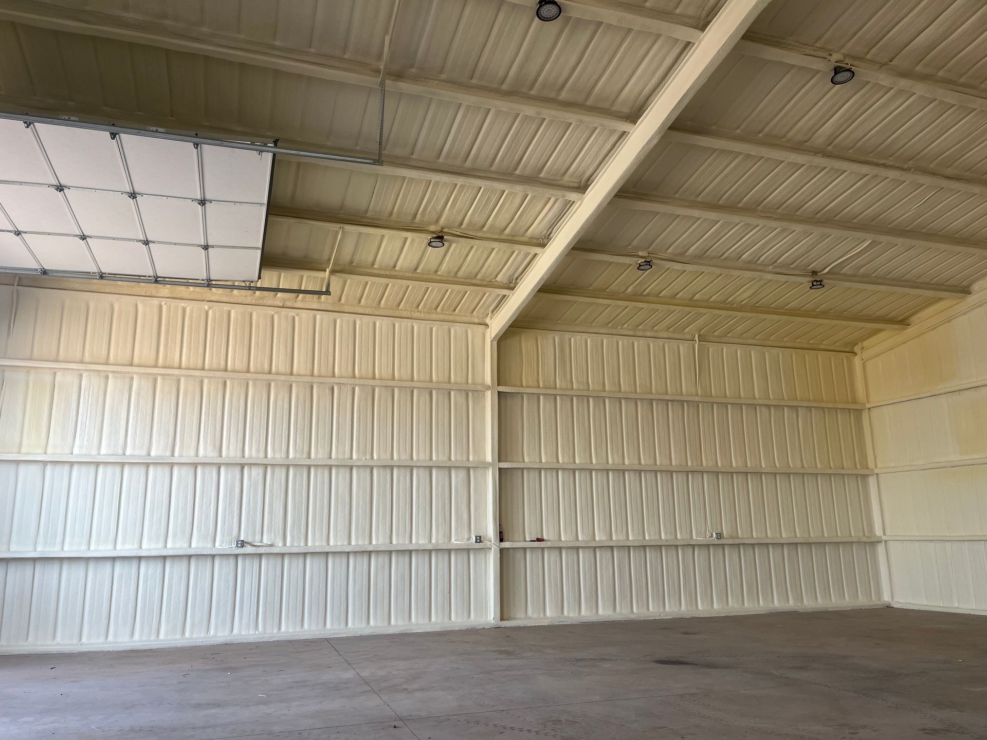 An empty warehouse with a ceiling that is very high