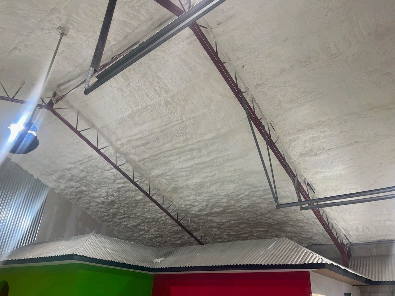 A garage with a lot of foam on the ceiling.