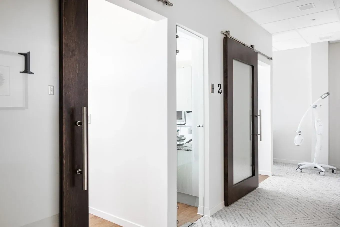 Hallway with three open doorways.