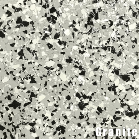 Close-up of a speckled flooring sample. Primarily gray, black, and white chips resembling granite.