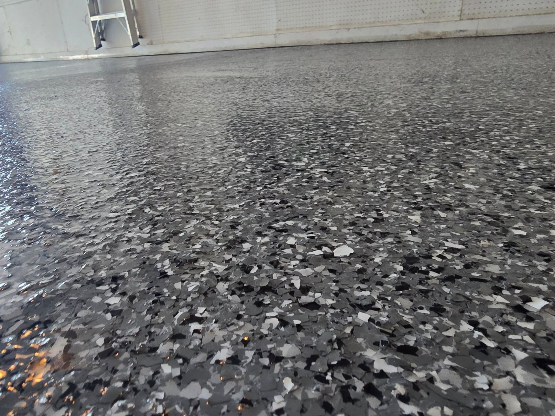 Gray speckled epoxy floor.