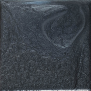 Square of swirling, dark gray metallic paint.