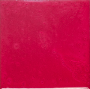 Square tile, glossy red surface.