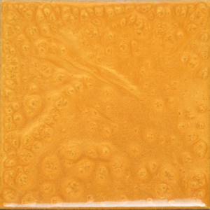 Yellow-orange square wood grain with knot-like patterns and glossy finish.