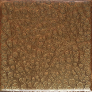 Square brown tile with a bubbly, textured surface.