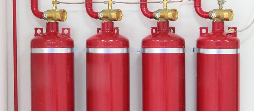 Fire Extinguishers lined up on wall