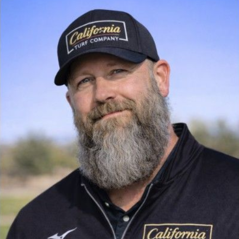 Silhouette of a person in a suit against a gray background.