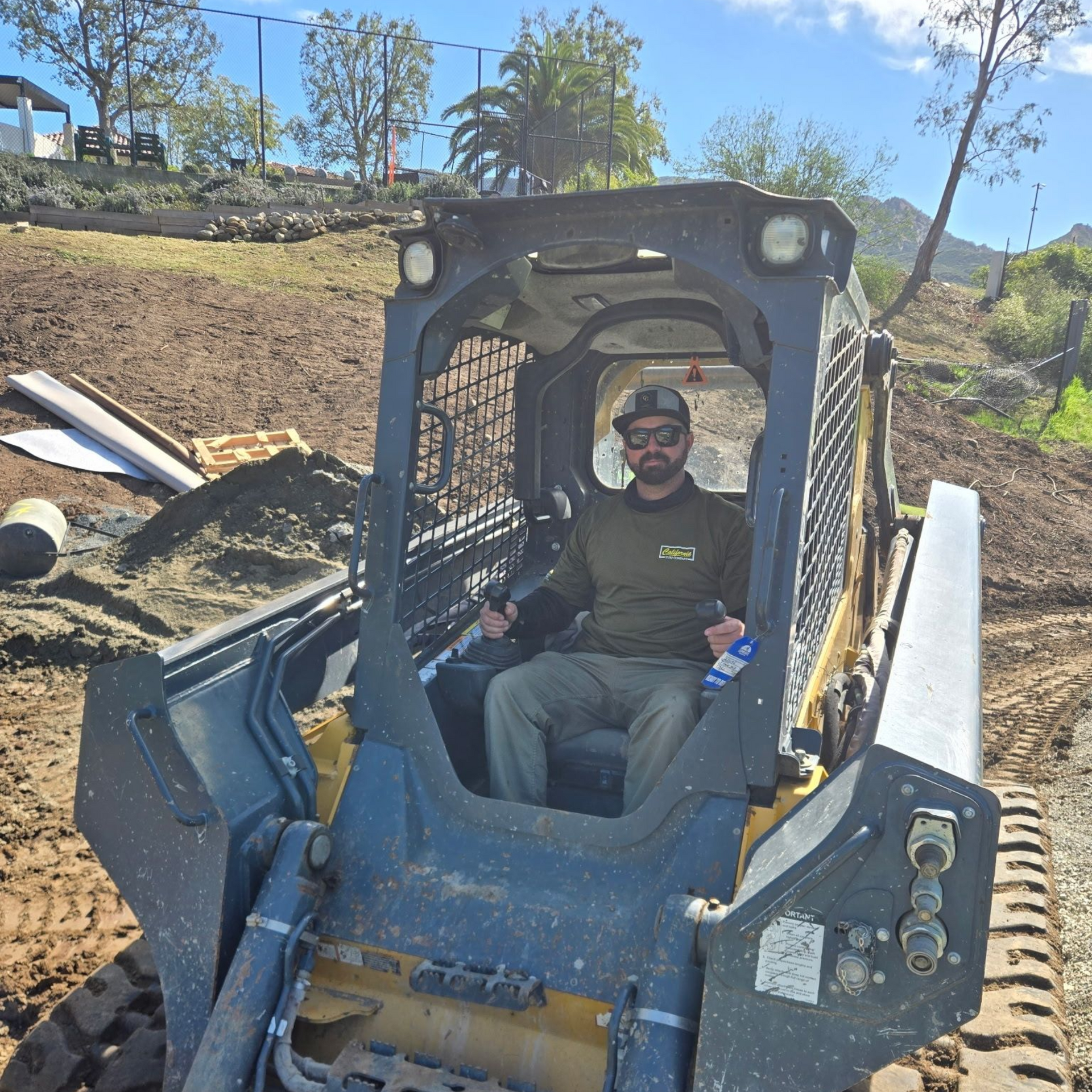 Silhouette of a person in a suit against a gray background.