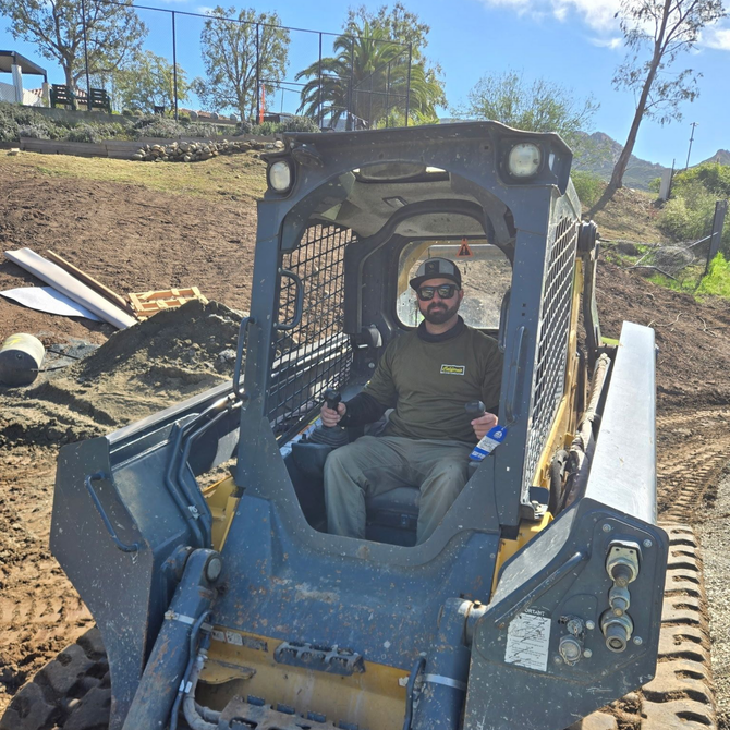 Silhouette of a person in a suit against a gray background.