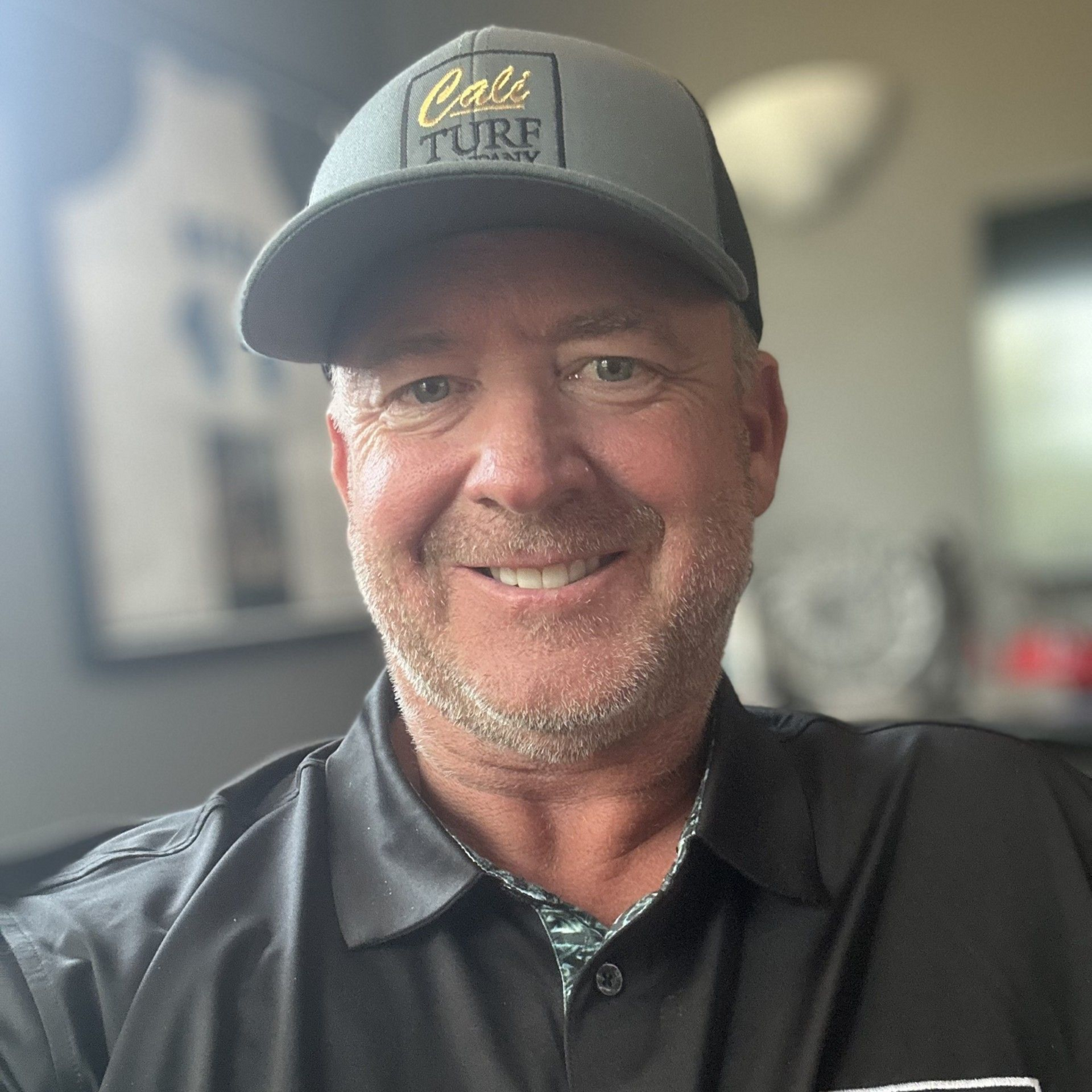 Silhouette of a person in a suit against a gray background.