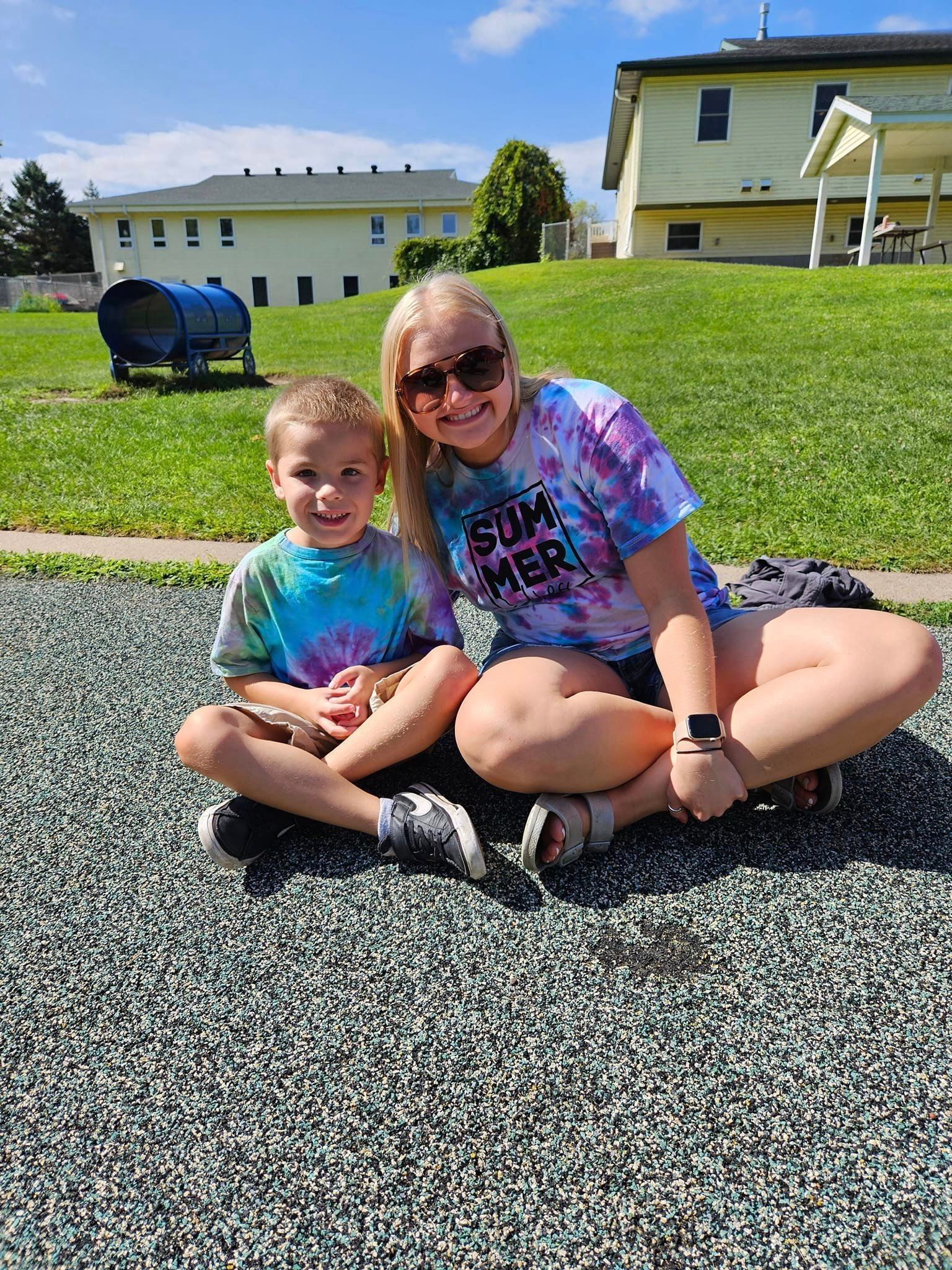Boy and girl sitting outside