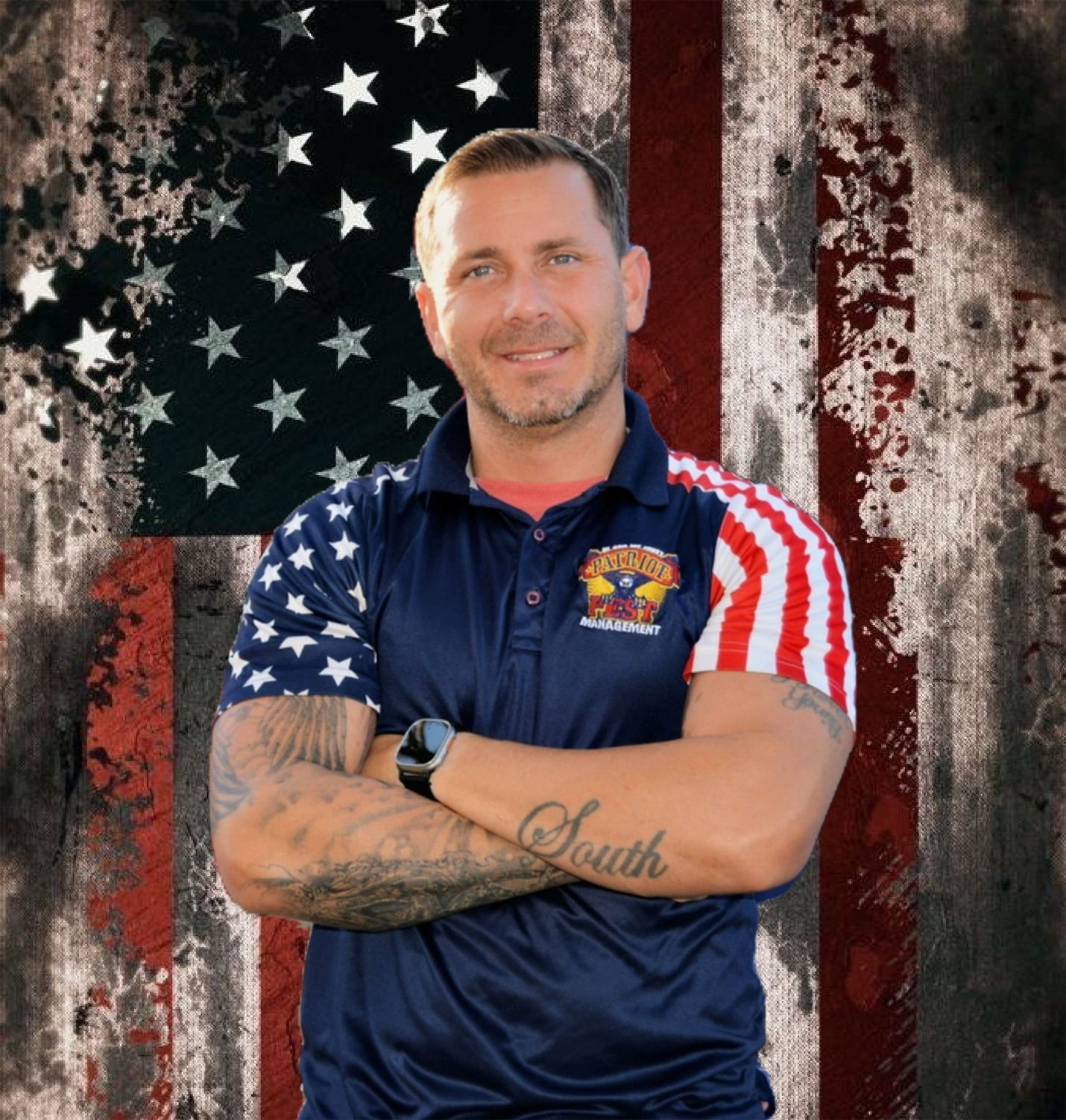 A man stands with arms crossed against an American flag background, wearing a navy polo shirt with patriotic accents.