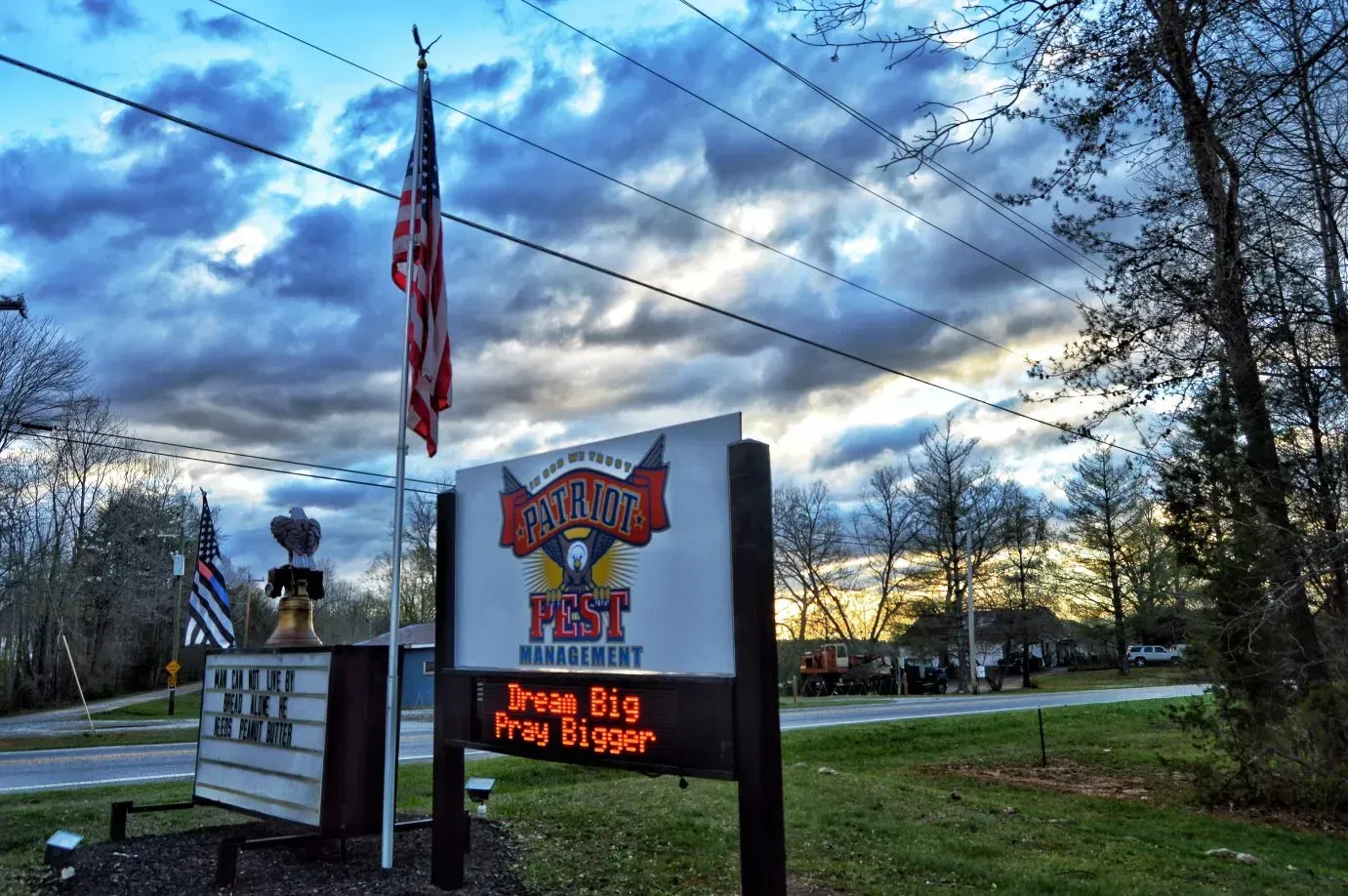 company signboard and road and sky
