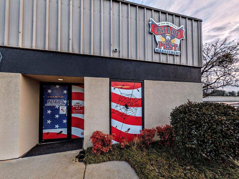 Exterior of Galvez Post, with American flag-themed doors. A logo is visible above the entrance.