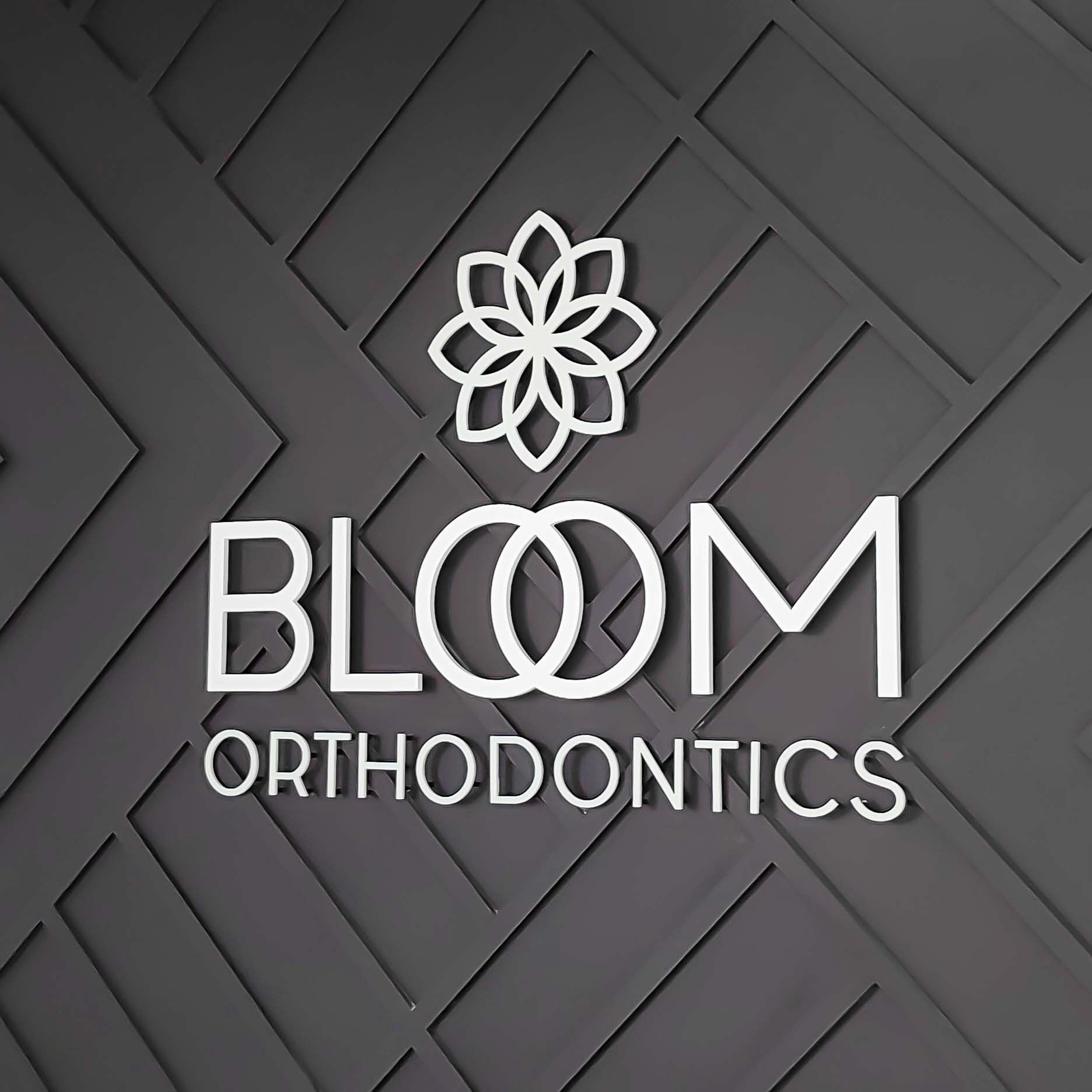 Custom Wall Texture with Acrylic Dimensional Brand Logo Standoff Mount to Office Wall Bloom Orthodontics Centennial Colorado