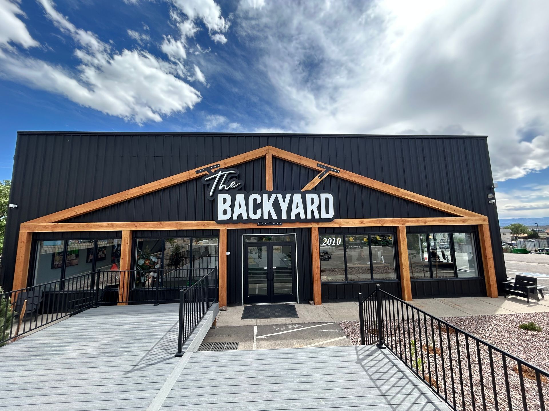 Illuminated Channel Letter Sign with Backer Panel The Backyard Longmont Colorado Illuminated Channel Letter Sign with Backer Panel The Backyard Longmont Colorado