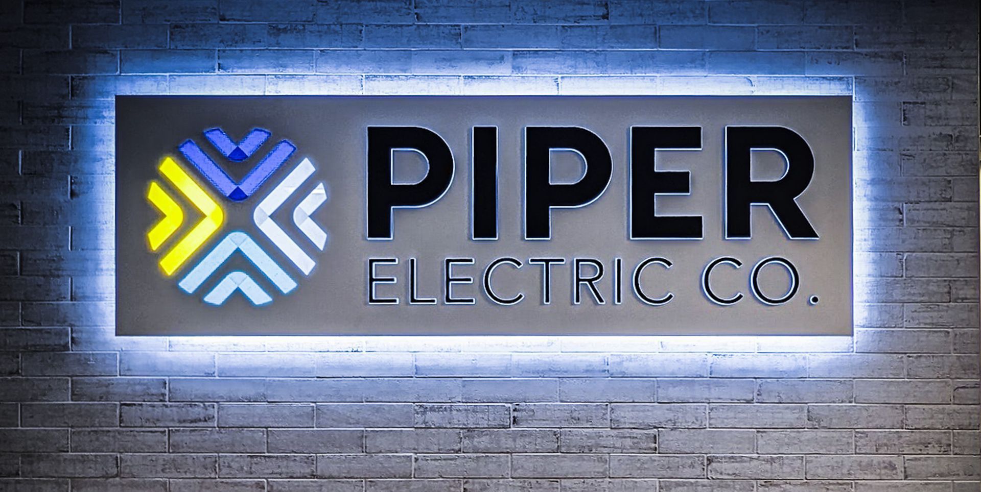Custom LED Halo and Facelit Push Through Acrylic with Translucent Brand Logo Floating Panel office Brand Decor Piper Electric Company Arvada Colorado Custom LED Halo and Facelit Push Through Acrylic with Translucent Brand Logo Floating Panel office Brand Decor Piper Electric Company Arvada Colorado