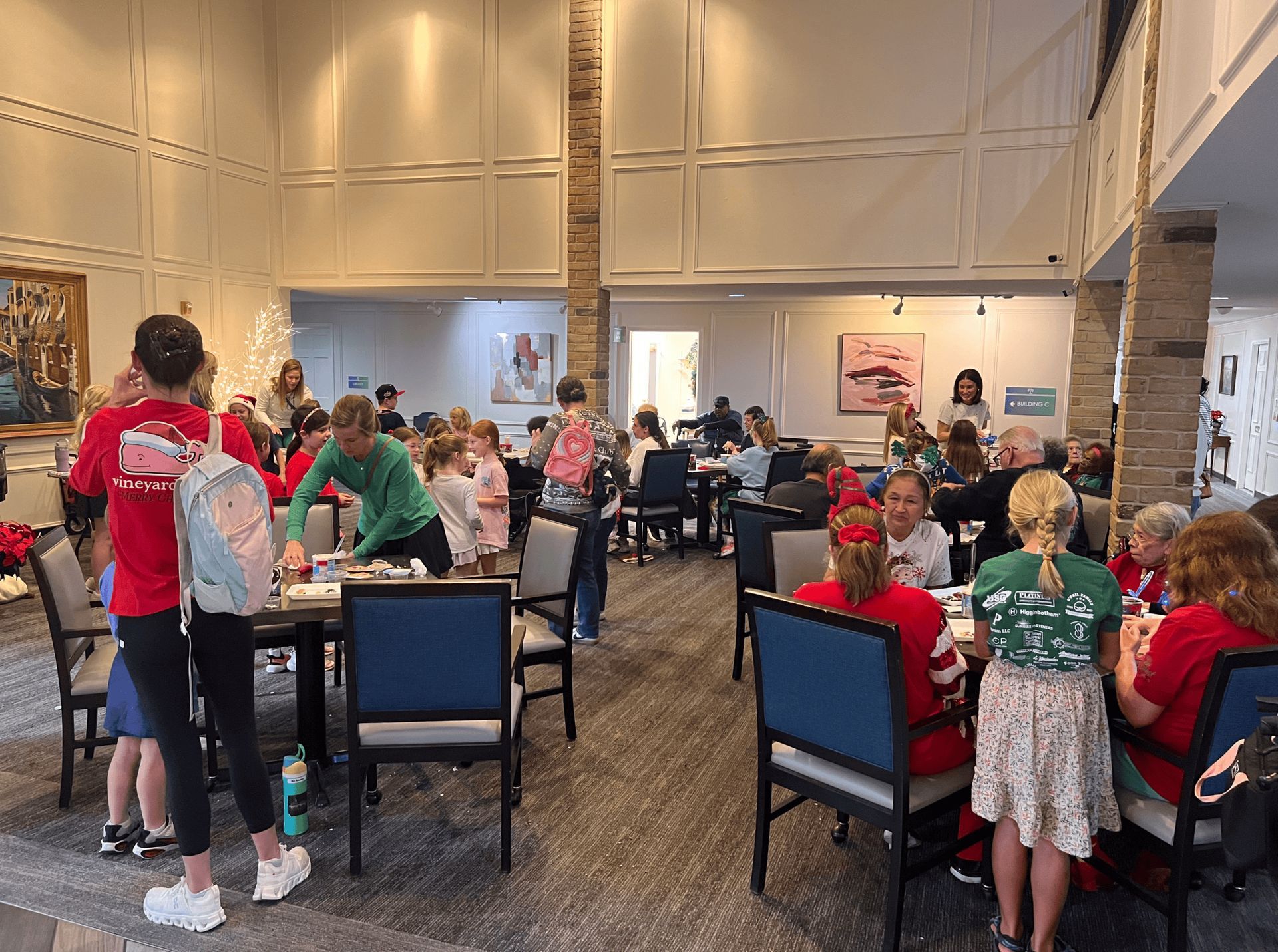 Bright lighting and art on walls create a cheerful, community-focused atmosphere