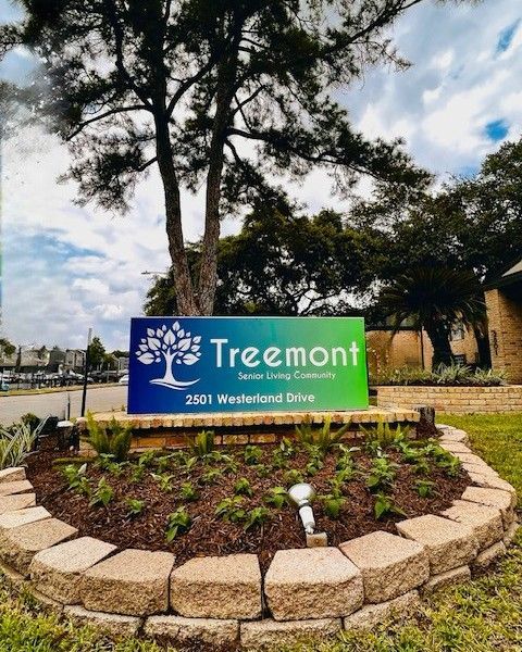 Treemont Special Living Community sign. Blue and green sign with a tree logo, address 2501 Westerland Drive.