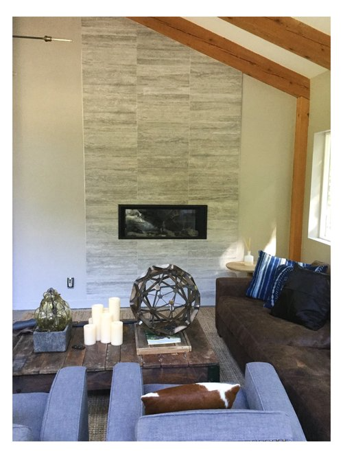 A living room with a fireplace and a couch