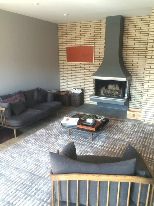 A living room with a fireplace and a couch